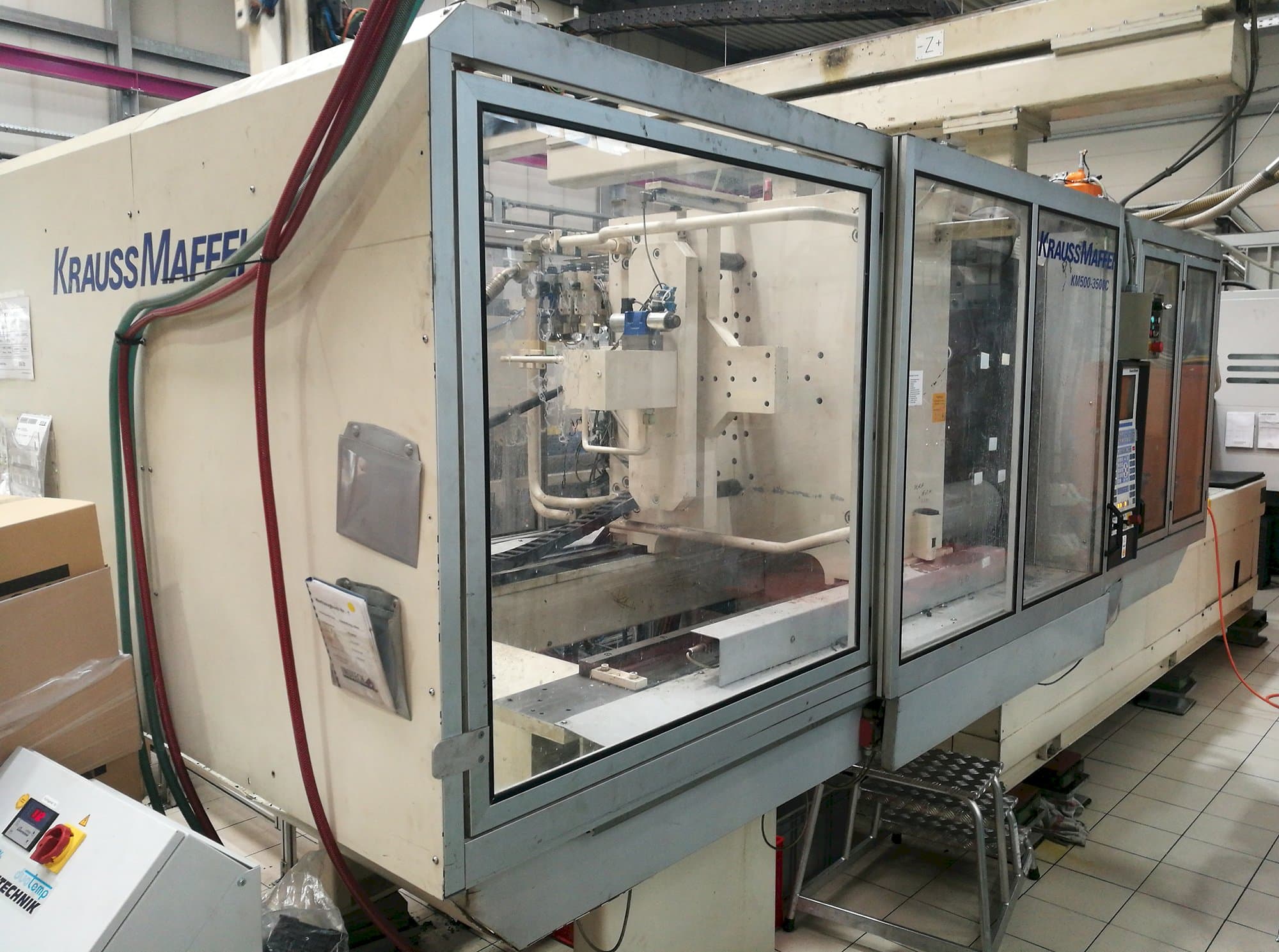 Left view of Krauss Maffei KM 500-3500 C1 Machine