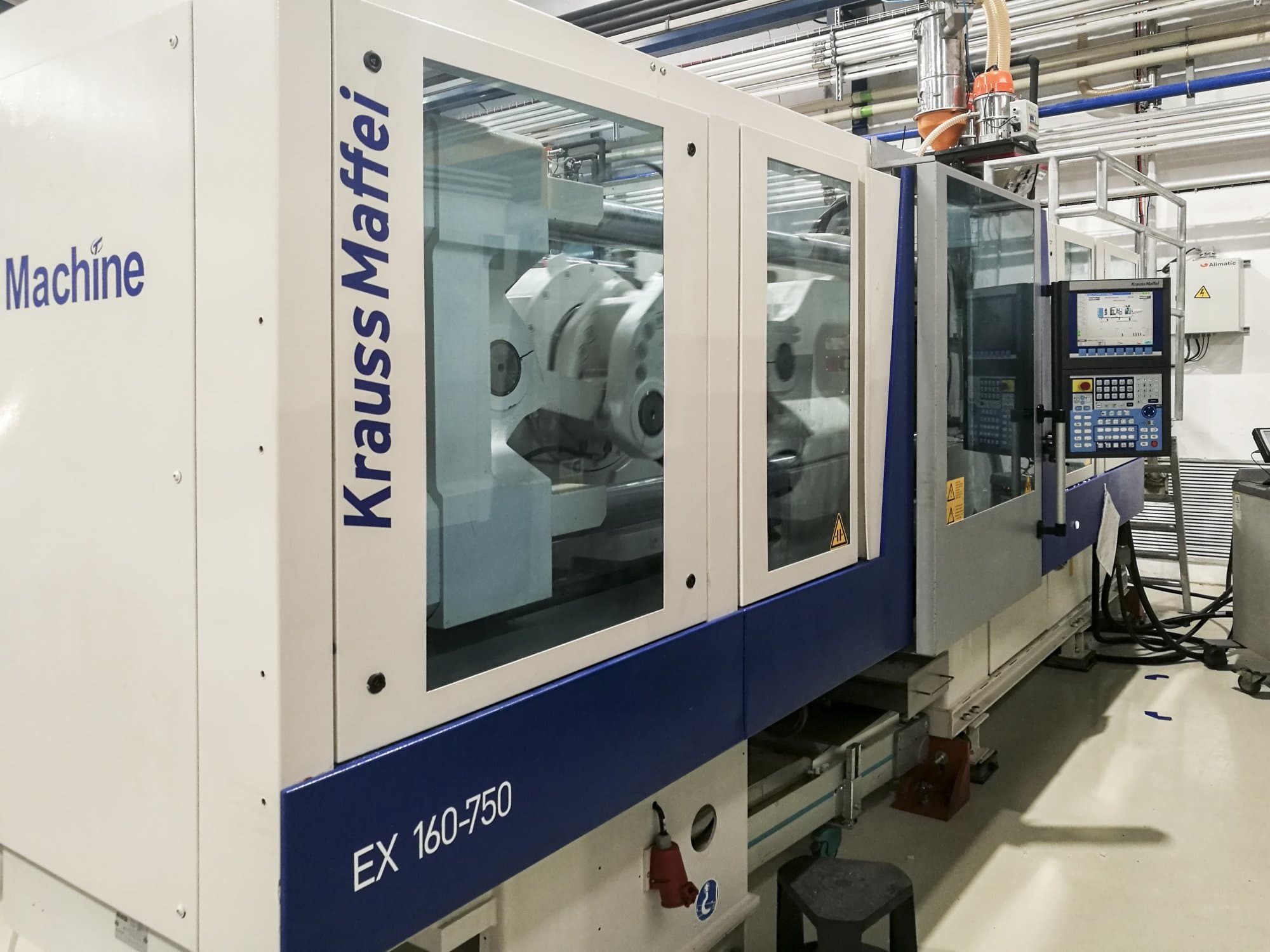 Left view of Krauss Maffei 160-750 EX Machine