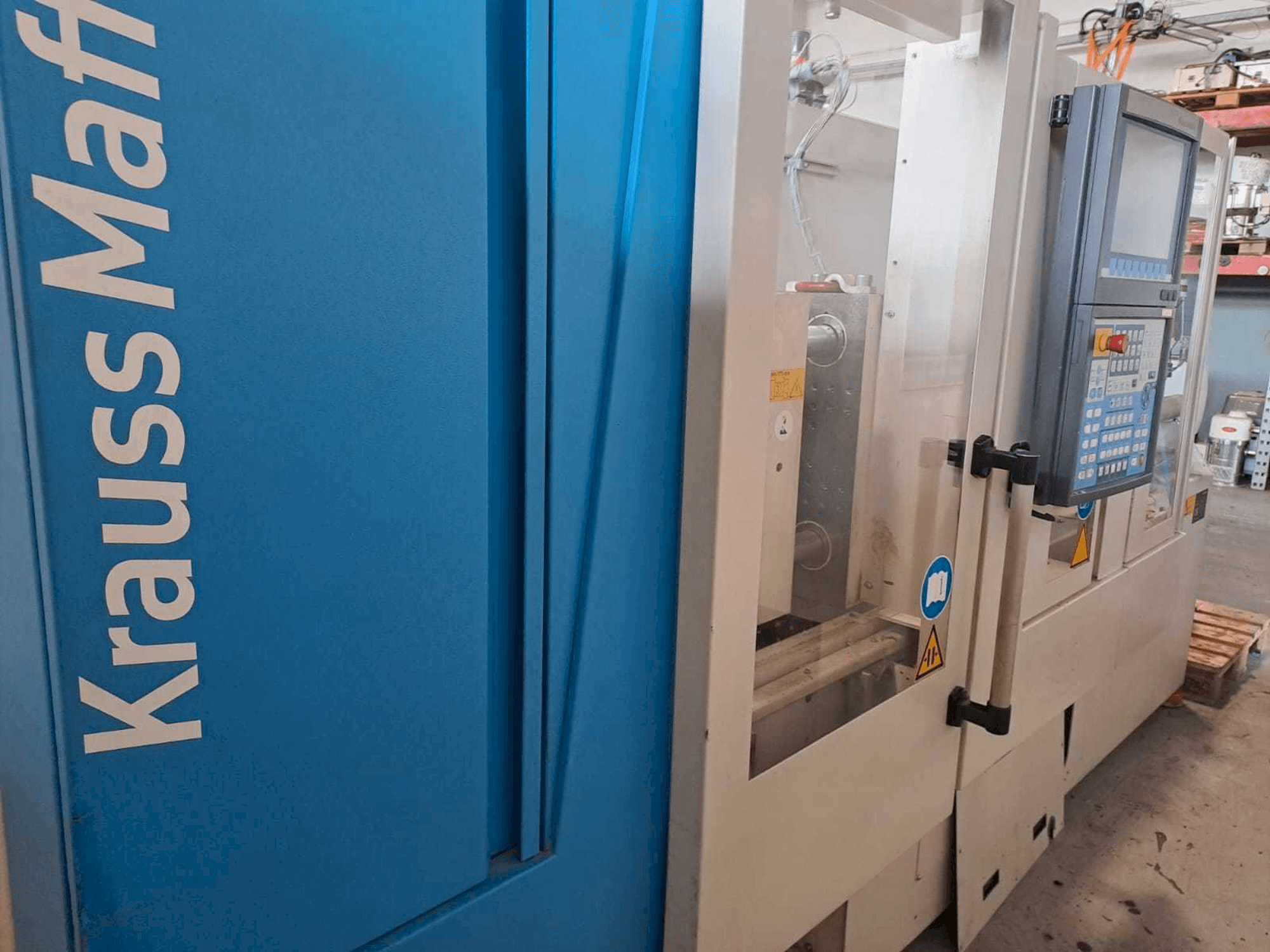 Front view of Krauss Maffei 35-180CX machine