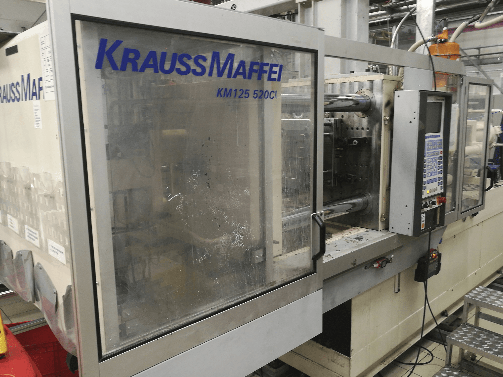 Front view of Krauss Maffei KM 125-520 C1 Machine